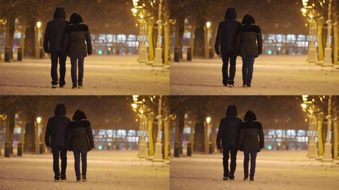 【4K升格】夜晚雪中情侣走路背影