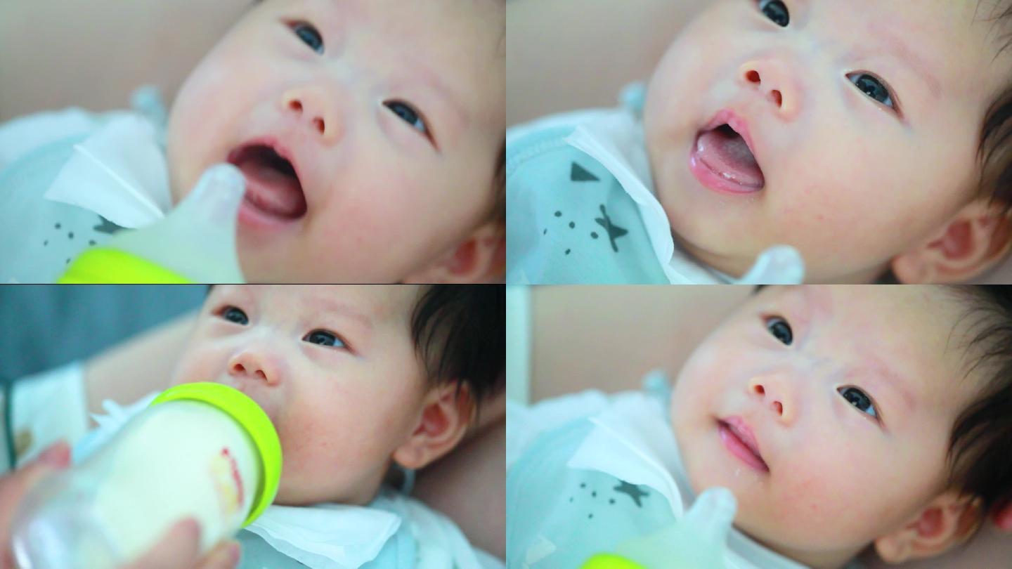 可爱的婴儿吃奶微笑