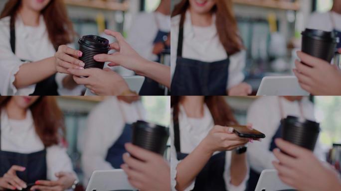 女人使用手机付款的特写镜头