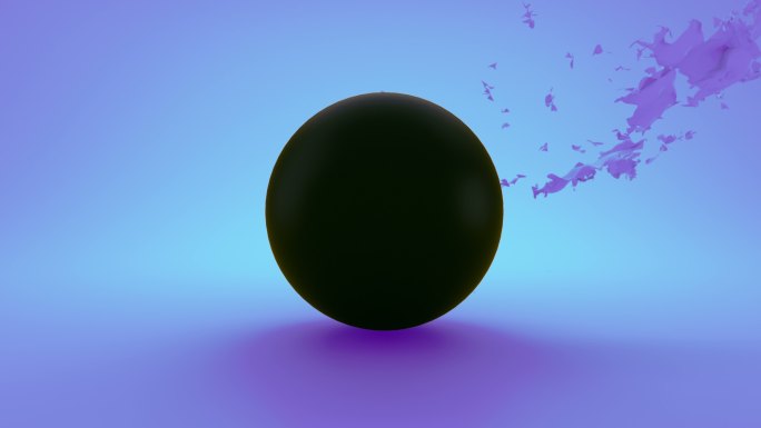 蓝色的材料被风从一个黑色的球上撕下来
