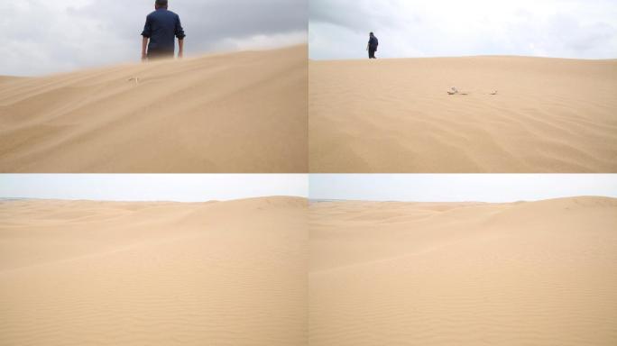 老人在沙漠行走
