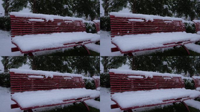 实拍公园雪落长椅