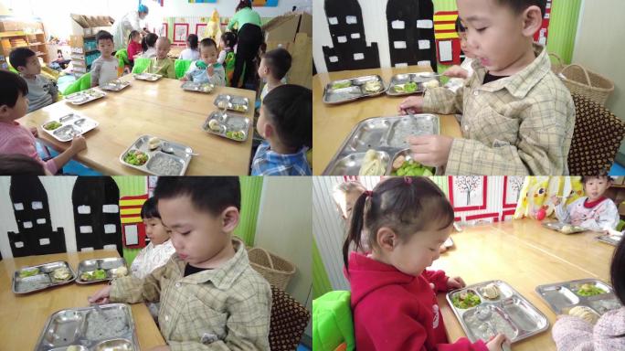幼儿园小朋友围在一起吃早餐老师分饭