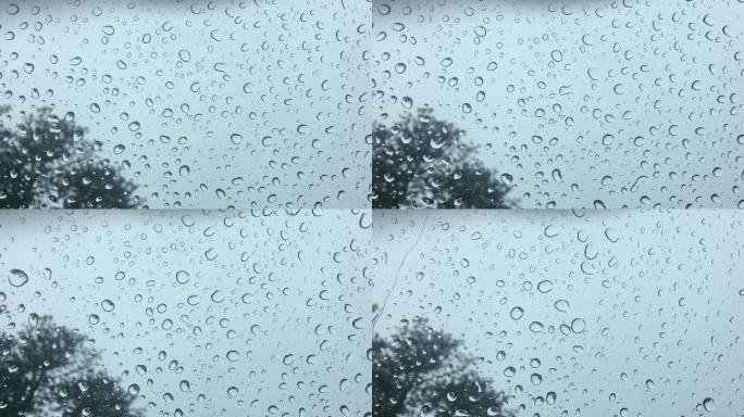 雨水在汽车挡风玻璃上形成水珠