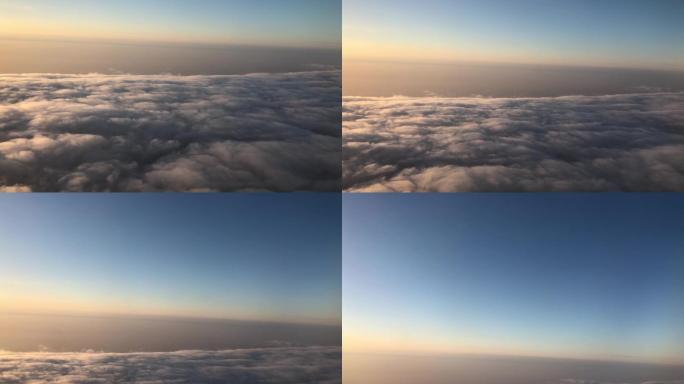 飞机飞上云层窗外景色