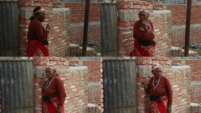 尼泊尔 加都 乡农村 老太太 红墙