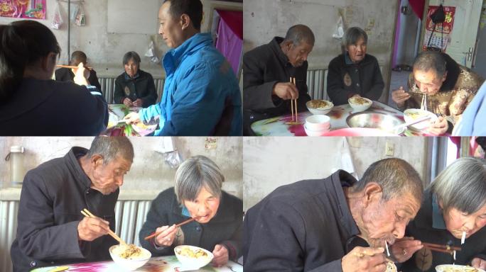 农村贫困一家人围在一起吃面条生活困难