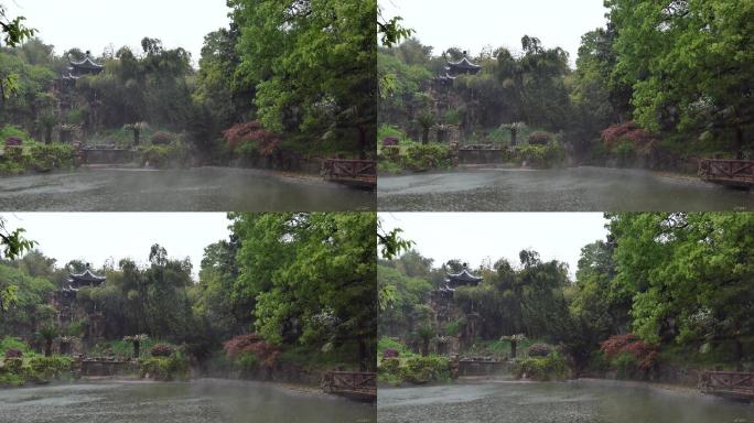 雨天小雨里的园林庭院建筑水池雨景