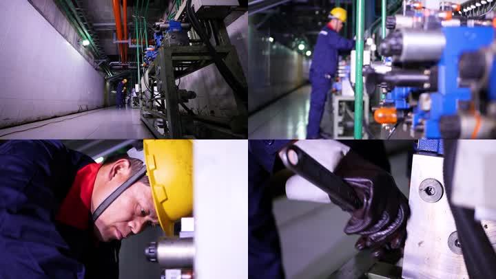 技术工人检查维护工厂车间设备机器