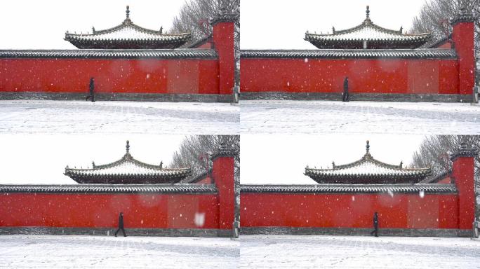 大雪中故宫门前红墙下的孤独行人升格
