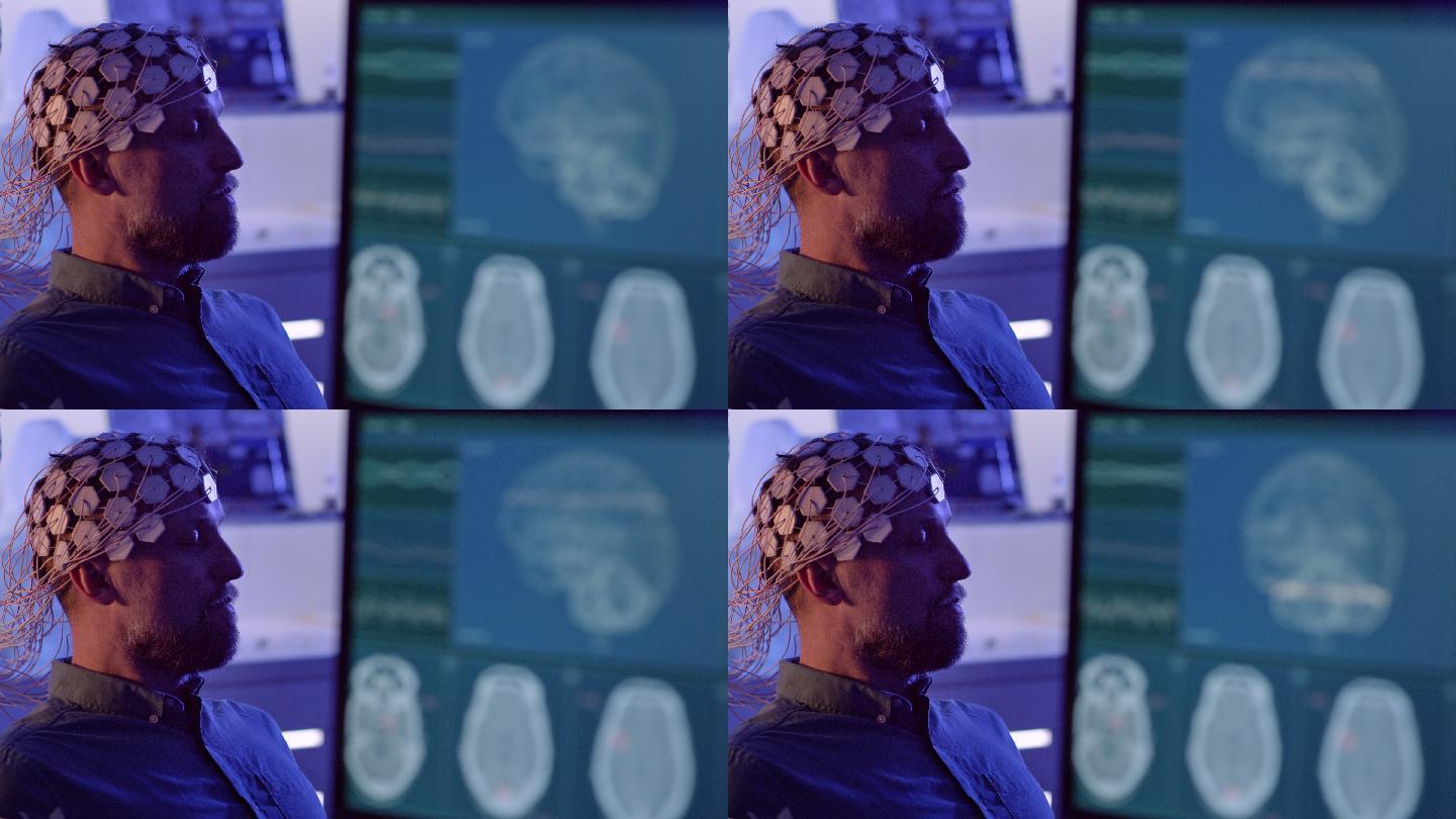 戴着脑波扫描耳机的男子