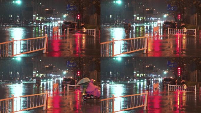 夜晚大雨后湿润的城市道路车辆川流不息