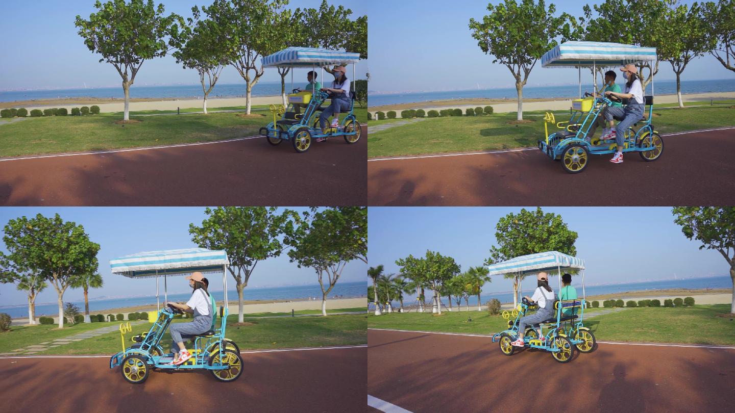 厦门彩虹沙滩滨海公园骑行的男女