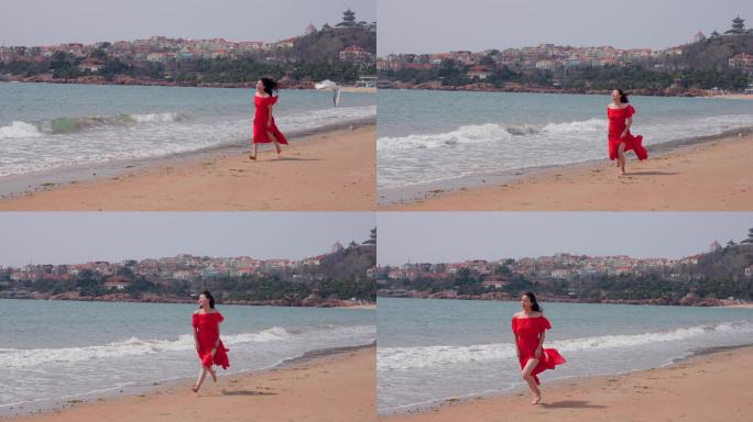 美女海边奔跑-红衣美女海边度假旅游休闲