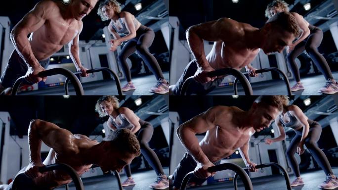 女性私人教练激励男性在健身房锻炼