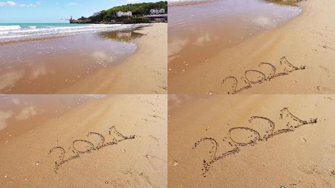 在沙滩上写新年海边
