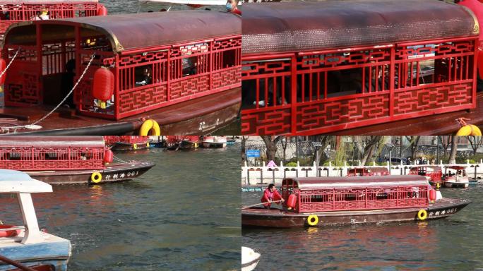 北京后海公园游客乘游船在湖中嬉戏游玩