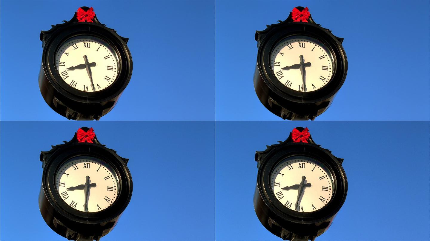 蓝色背景前的时钟钟表计时器时刻