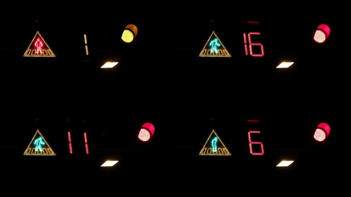 夜间的人行横道标志和交通灯。