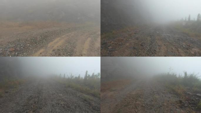 恶劣天气大雾汽车行驶在山路上