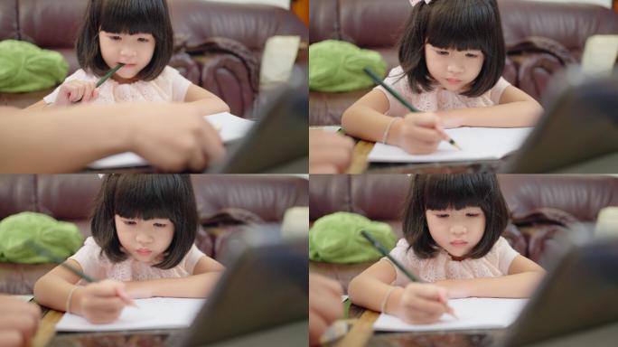 做作业的小女孩可爱童真认真写作业上网课