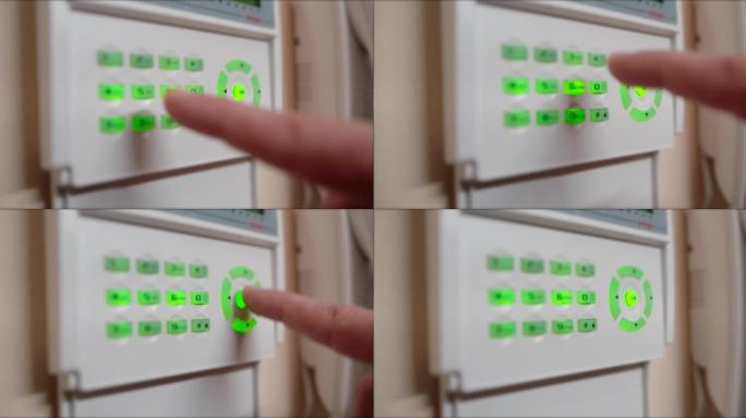 男子在家庭安全系统上输入密码