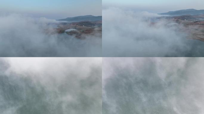 航拍湖泊湖畔日出云雾袅绕美景