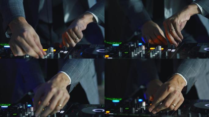DJ调整各种音轨控制。