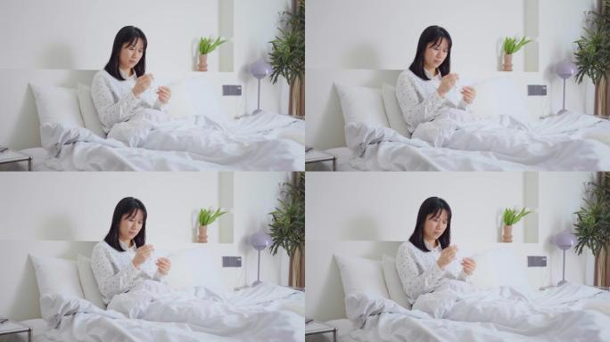 新冠疫情都市白领坐床上居家自测病毒抗原