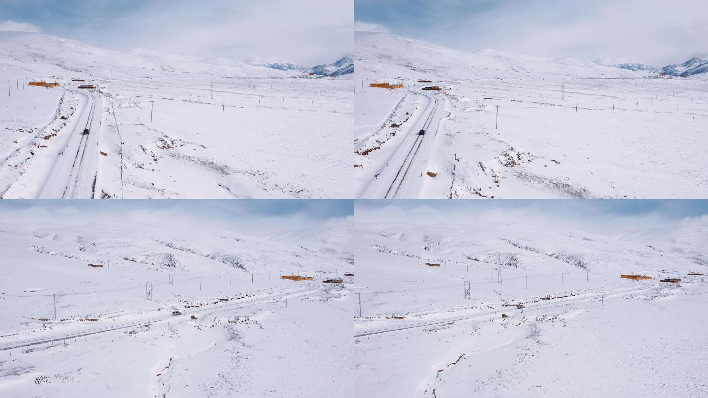 西藏国道317大雪中独行的汽车航拍