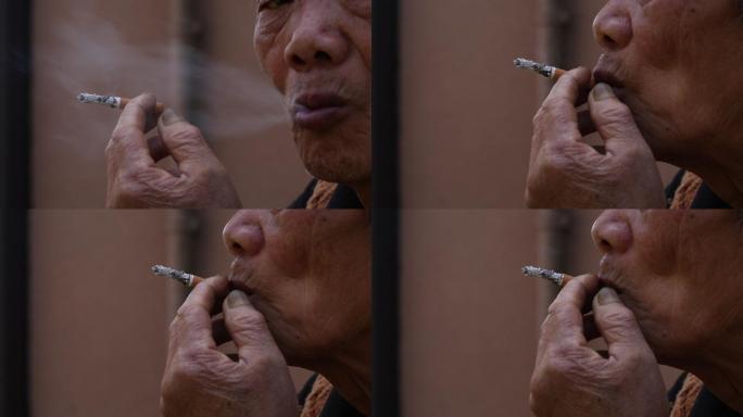 农村老人沧桑手拿香烟蒂头吸烟特写原素材