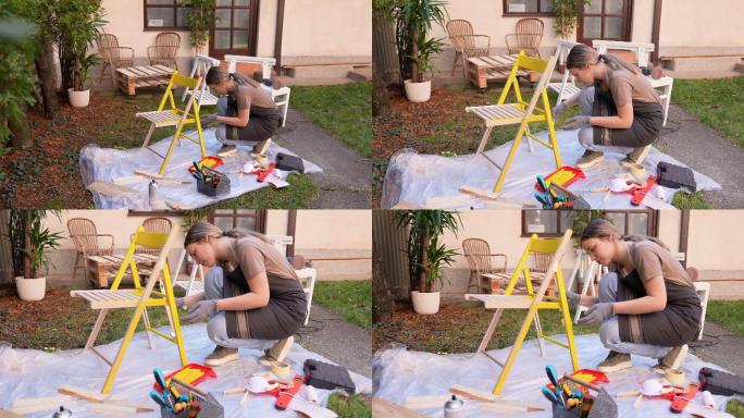 给凳子刷油漆的女人