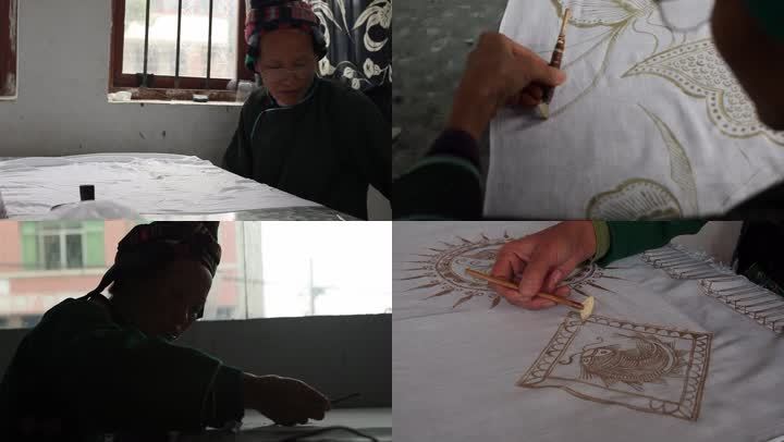 贵州少数民族妇女在手工绘制蜡染作品