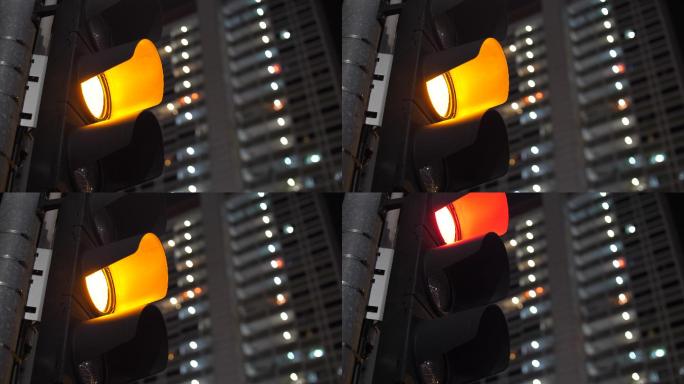 城市交通信号灯由黄变红的特写镜头