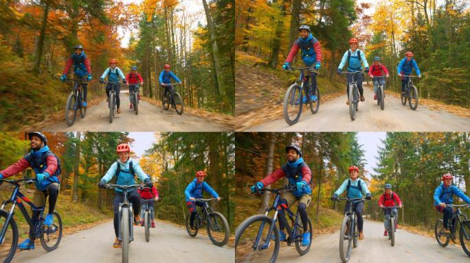 四个年轻人在森林小道上骑山地自行车