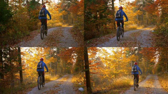 在秋天的森林里骑自行车的人