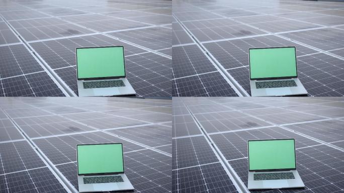太阳能电池上的绿幕笔记本电脑