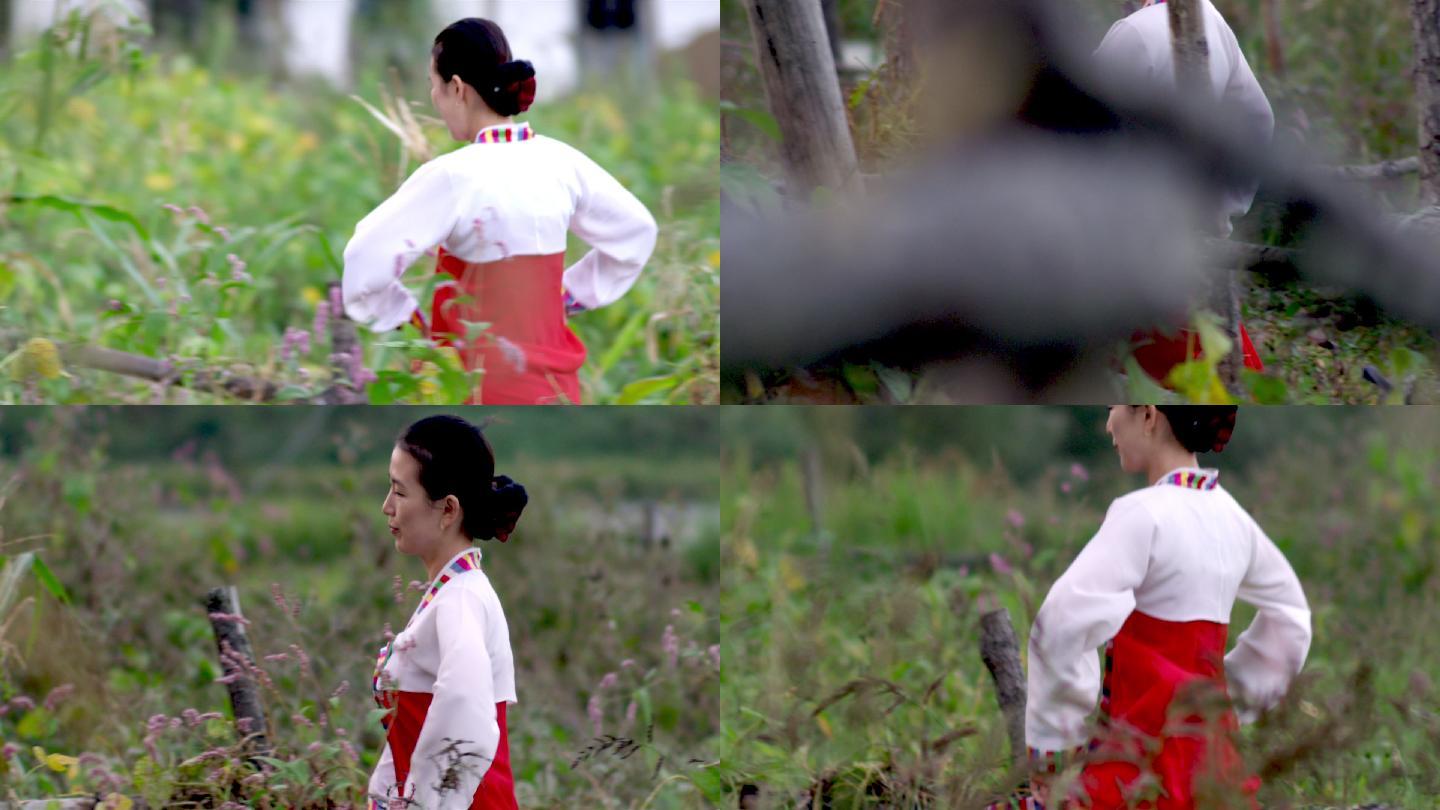朝鲜族女孩朝鲜服饰林中奔跑