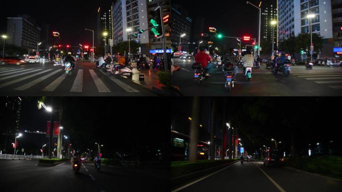深夜城市街道醉酒骑行电动自行车过马路