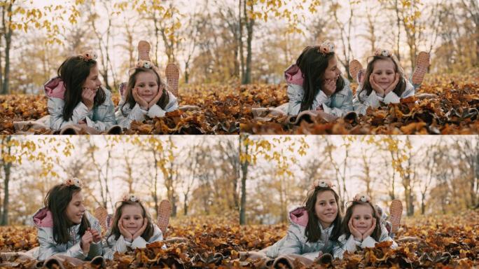 森林里的小女孩秋季户外落叶黄叶枯叶姐们合