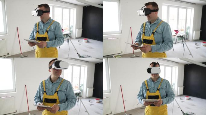 戴着虚拟现实眼镜和平板电脑的男性工作者