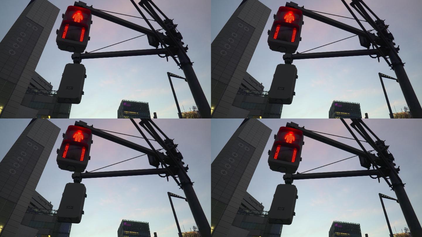 黄昏时分，城市人行横道上的红绿灯
