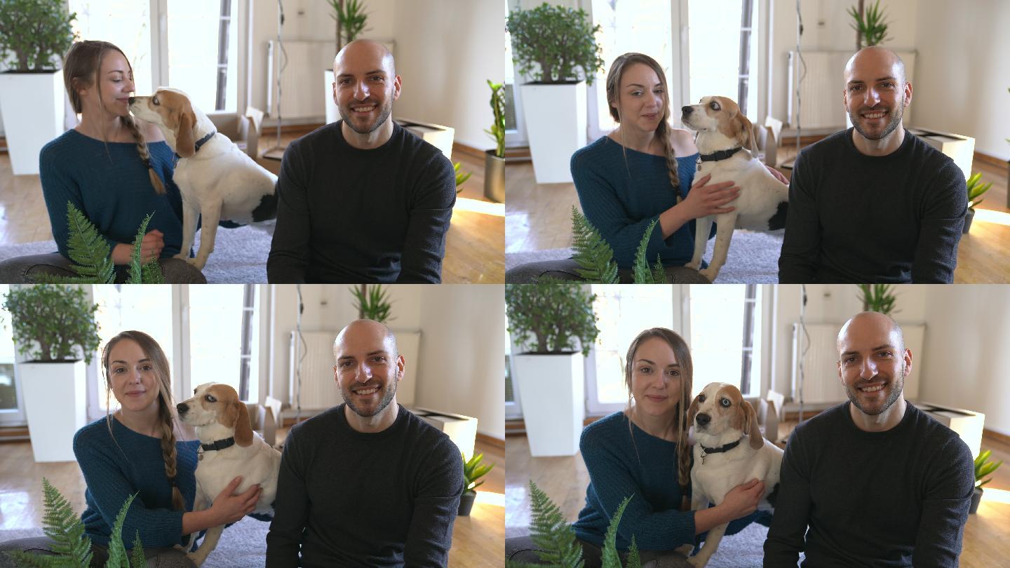年轻夫妇和小猎犬在新家的肖像