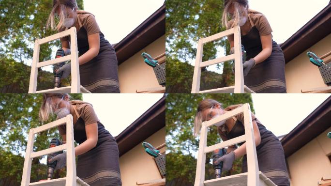 年轻女子打磨木椅木工木匠