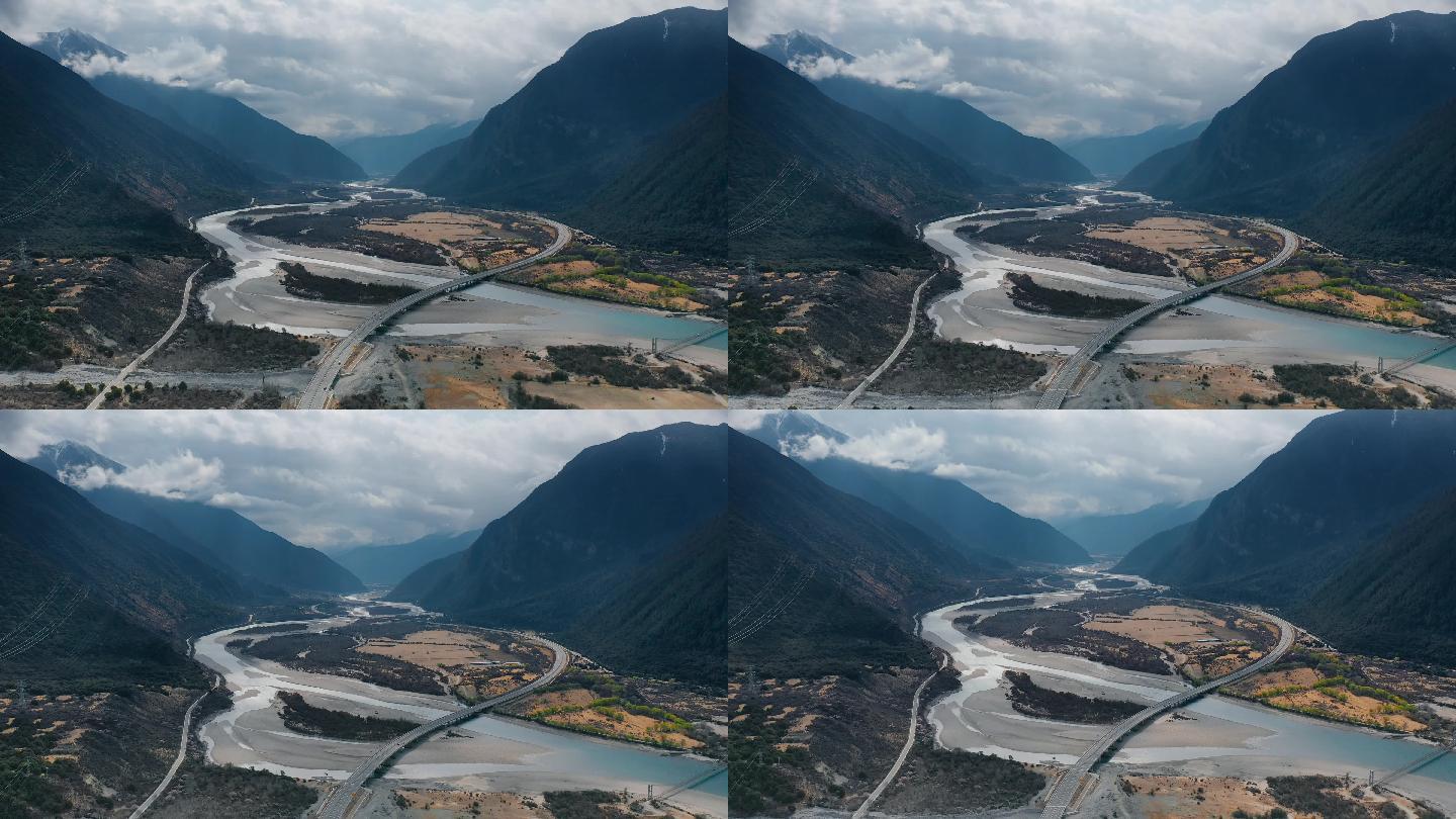 西藏风光视频玉带云山下河床沙洲公路桥