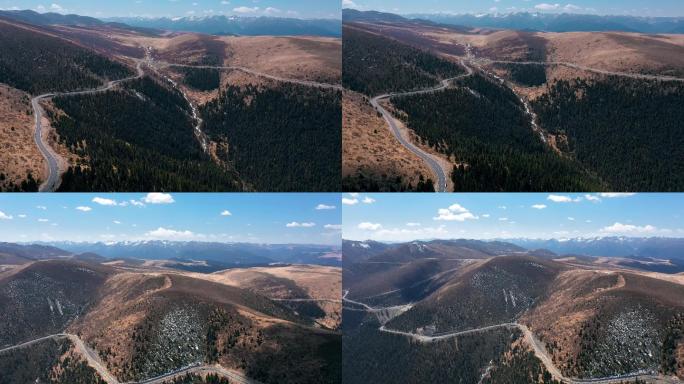 山路视频川西高原山区蜿蜒公路森林远处雪山