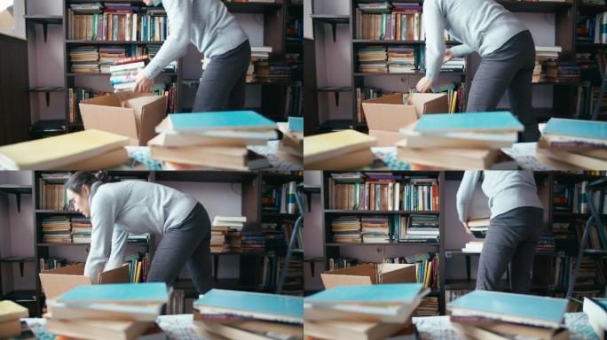 用硬纸盒打包书籍。搬出去。