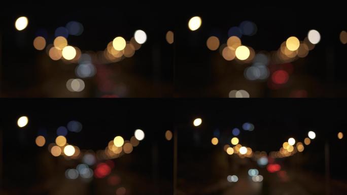 夜市灯光和交通信号灯散焦景观