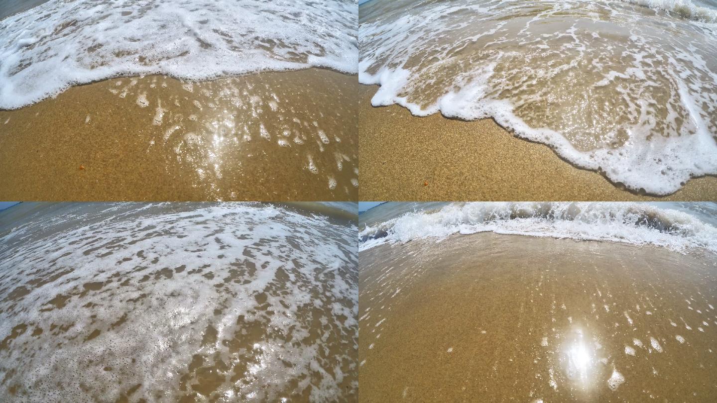 海浪卷起白色沙滩