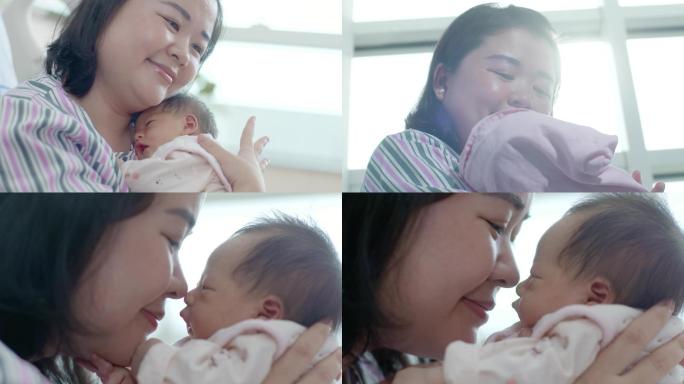新生儿妈妈亲吻新生儿产房温馨和谐婴儿场景